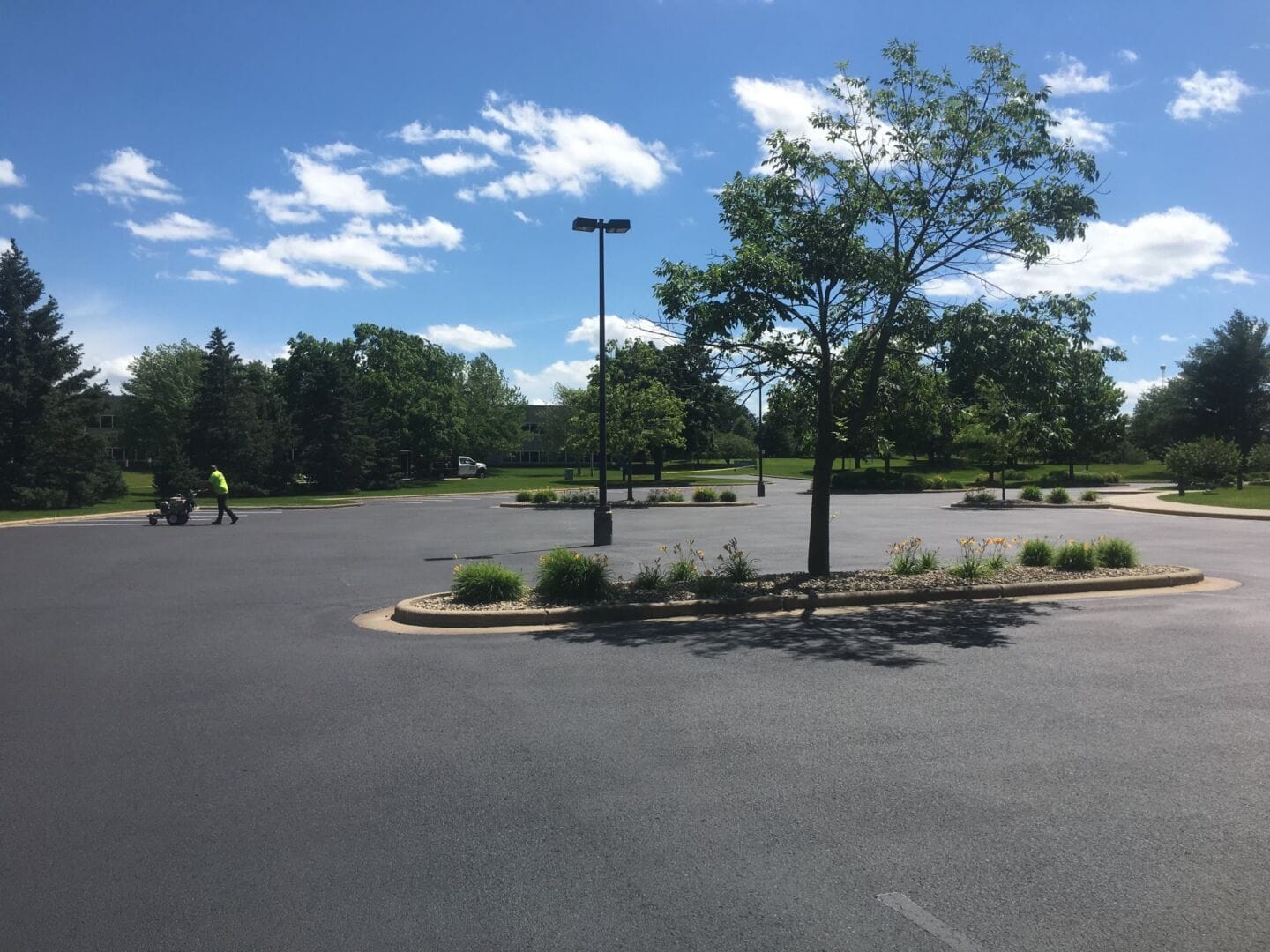 Completed commercial parking lot asphalt sealcoating and repair