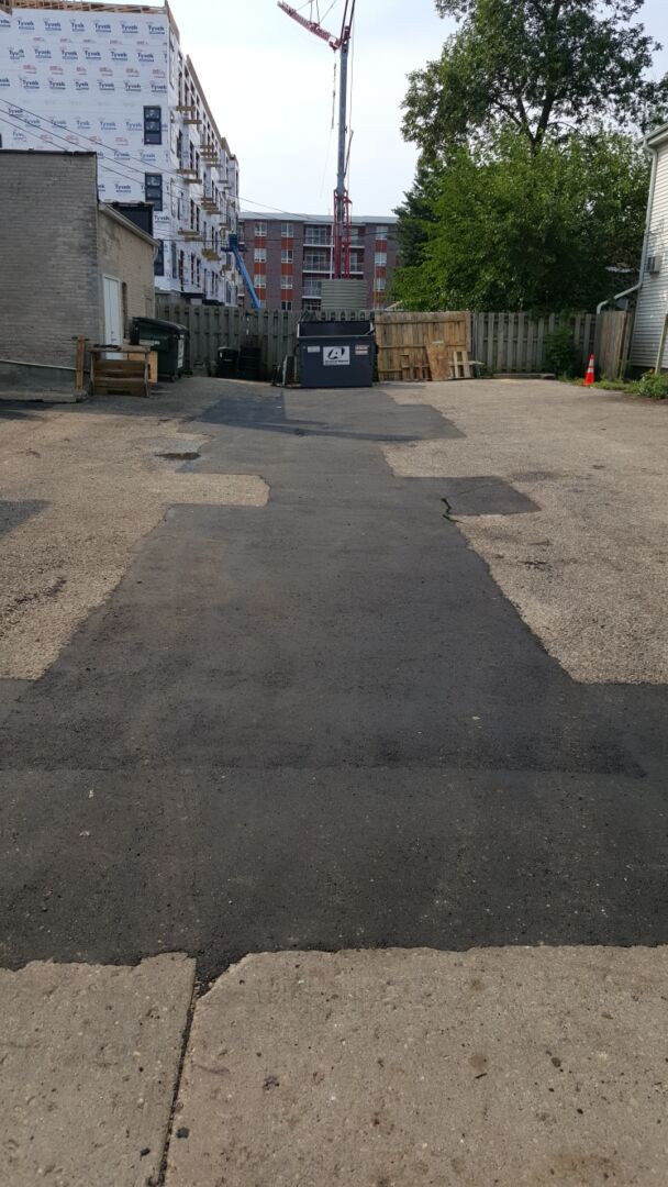 Seamless infrared asphalt patch repair completed by Renu Sealcoating in Madison, WI