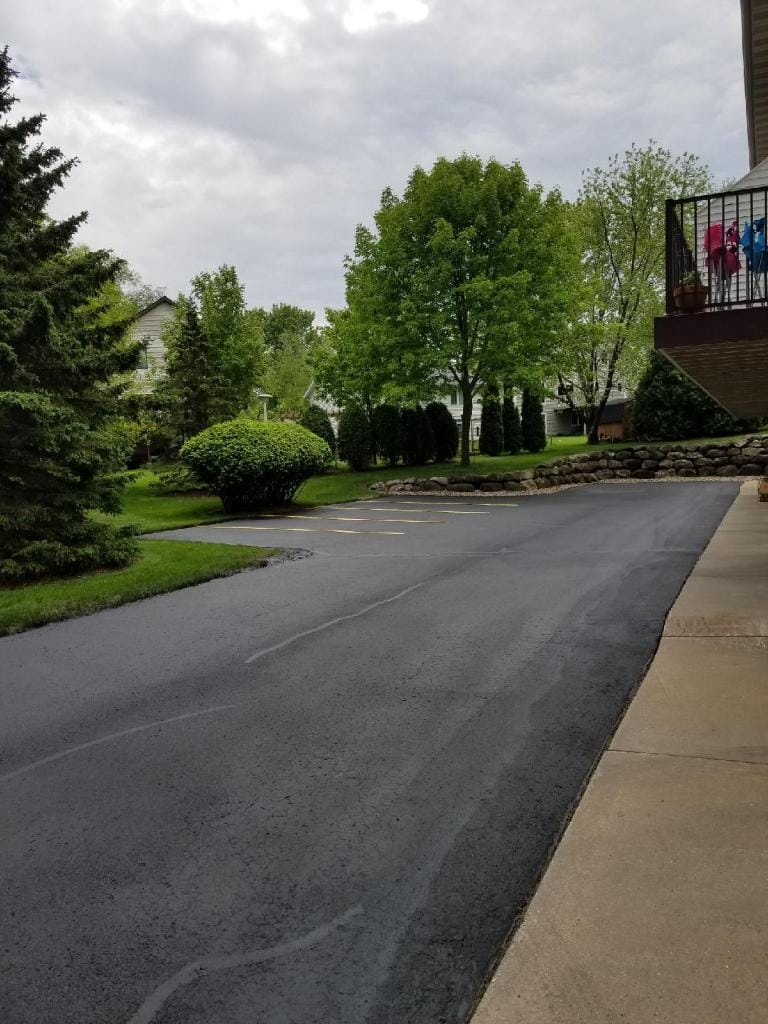 Finished residential driveway sealcoating with deep black color