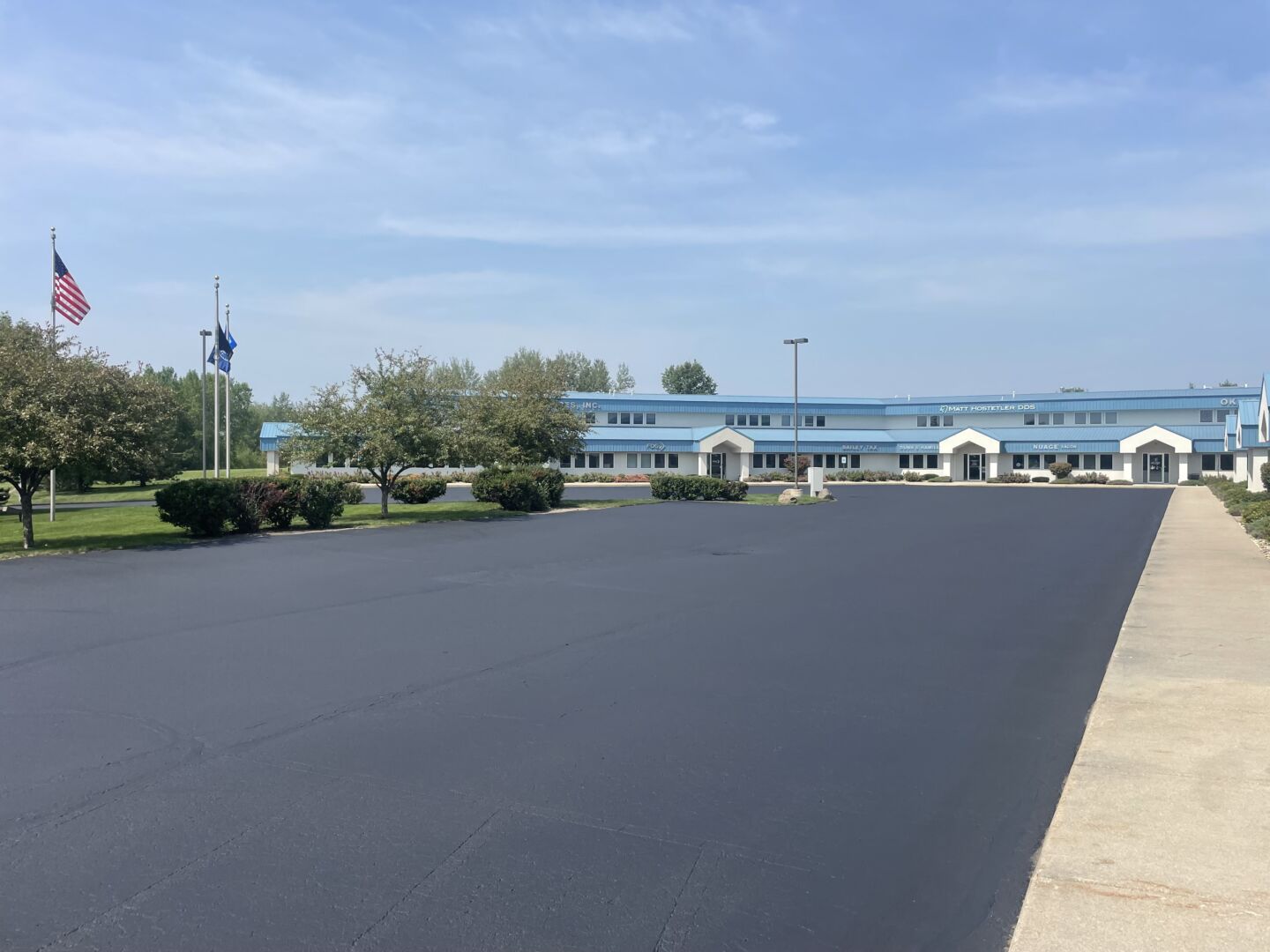 Large commercial parking lot sealcoating for office building in Wisconsin