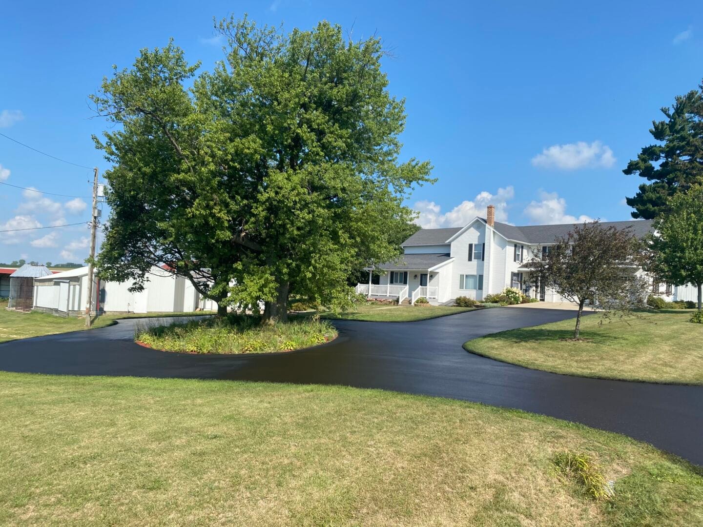 Circular driveway sealcoating on rural Wisconsin property