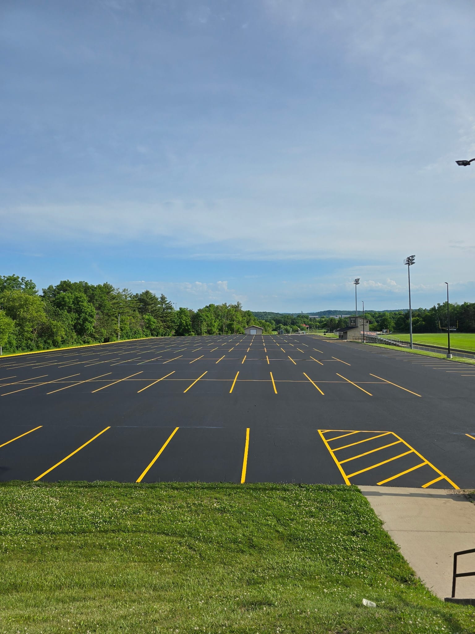 Freshly sealcoated and striped commercial parking lot by Renu Sealcoating in southern Wisconsin